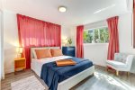 Master bedroom renders a queen-sized bed -ample space for two-